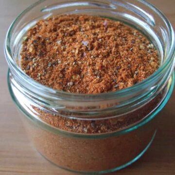 Mason jar on counter full of taco seasoning.