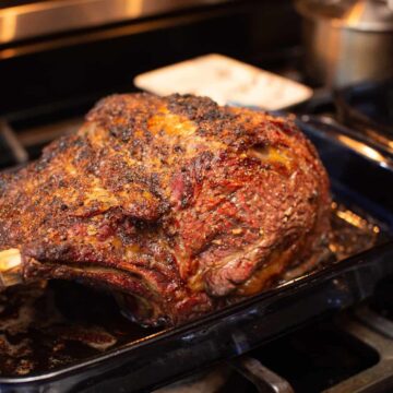 Leftover Prime Rib Recipes: Whole roasted prime rib in roasting pan on oven.