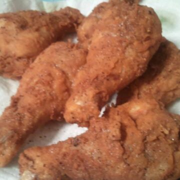 Fried chicken drumsticks on a paper towel
