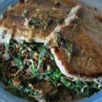 Spinach Stuffed Pork Chop with Lemon Caper Sauce on a Plate