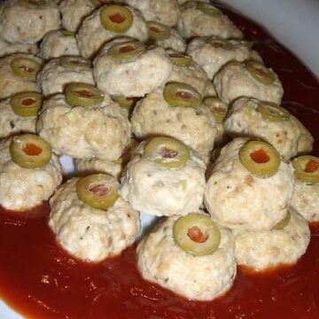bloody chicken eyeballs meatballs in a dish