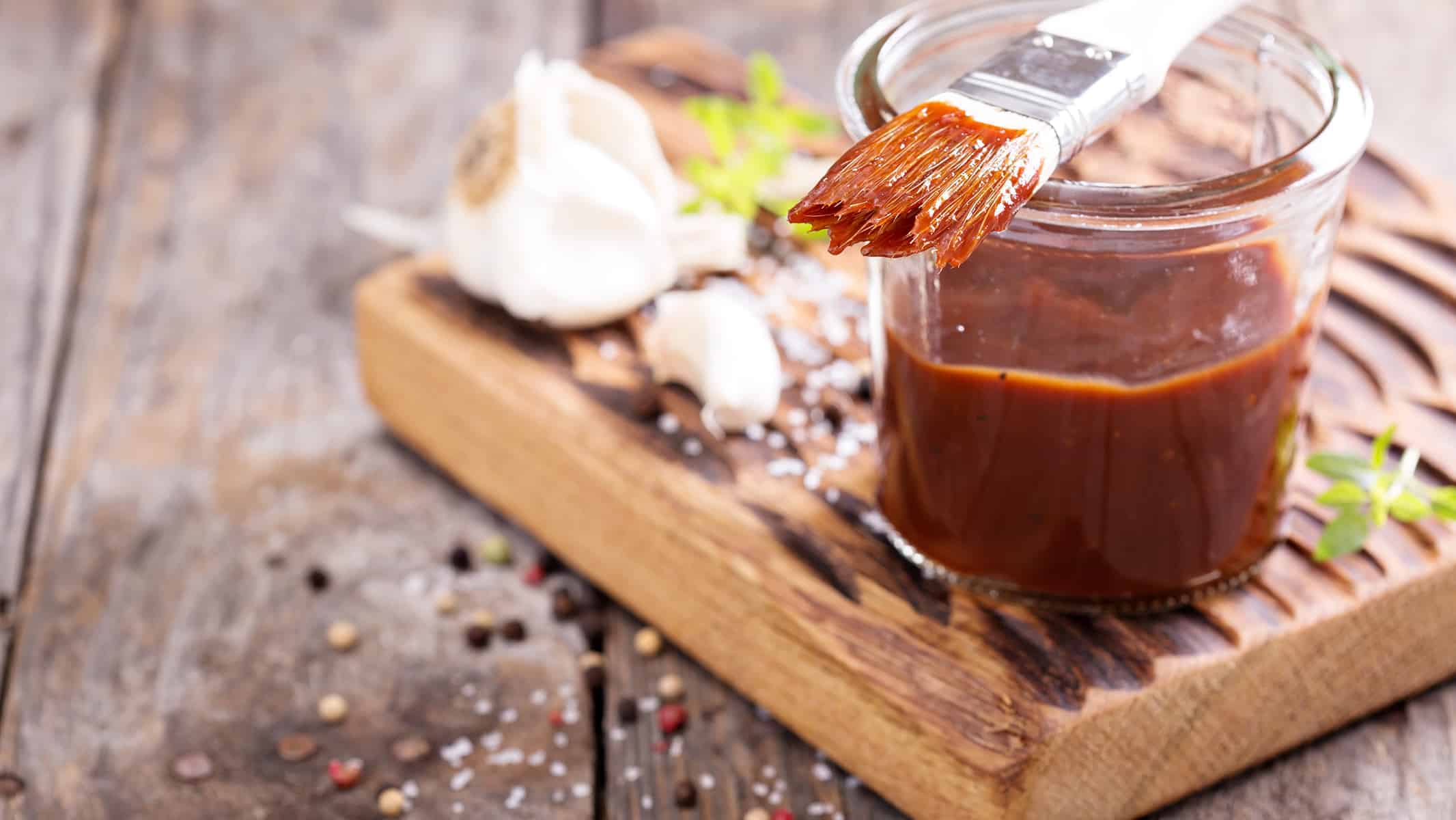 Keto & Low-Carb BBQ Sauce on the counter with brush.