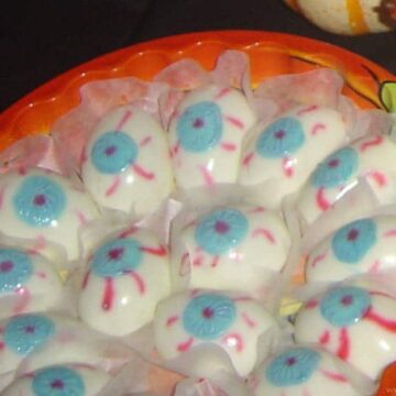 Upside-down deviled egg eyes on a Halloween plate