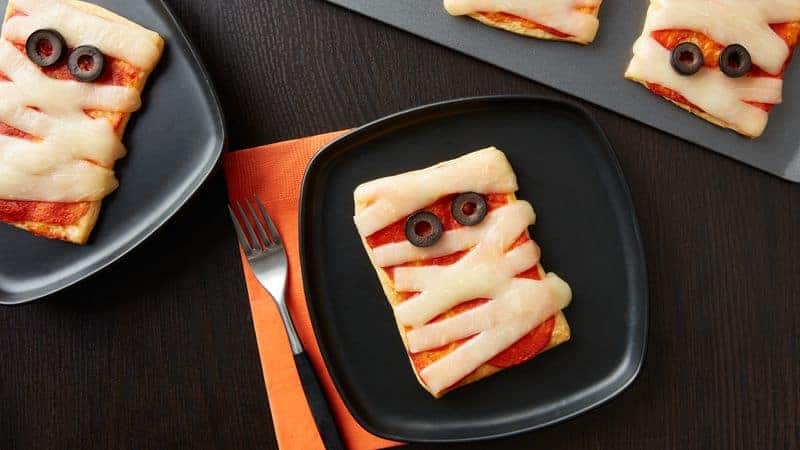 mini mummy pizzas on a plate