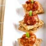 mini pumpkin cheese balls on a platter