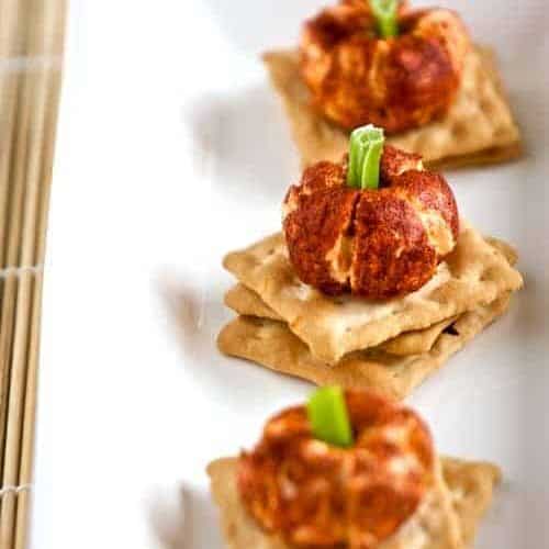 mini pumpkin cheese balls on a platter