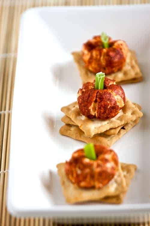 mini pumpkin cheese balls on a platter