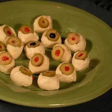 mozzarella eyeballs on a green plate