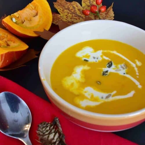 pumpkin sausage soup in a bowl on a fall decorated table