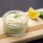 Homemade tartar sauce on black background.