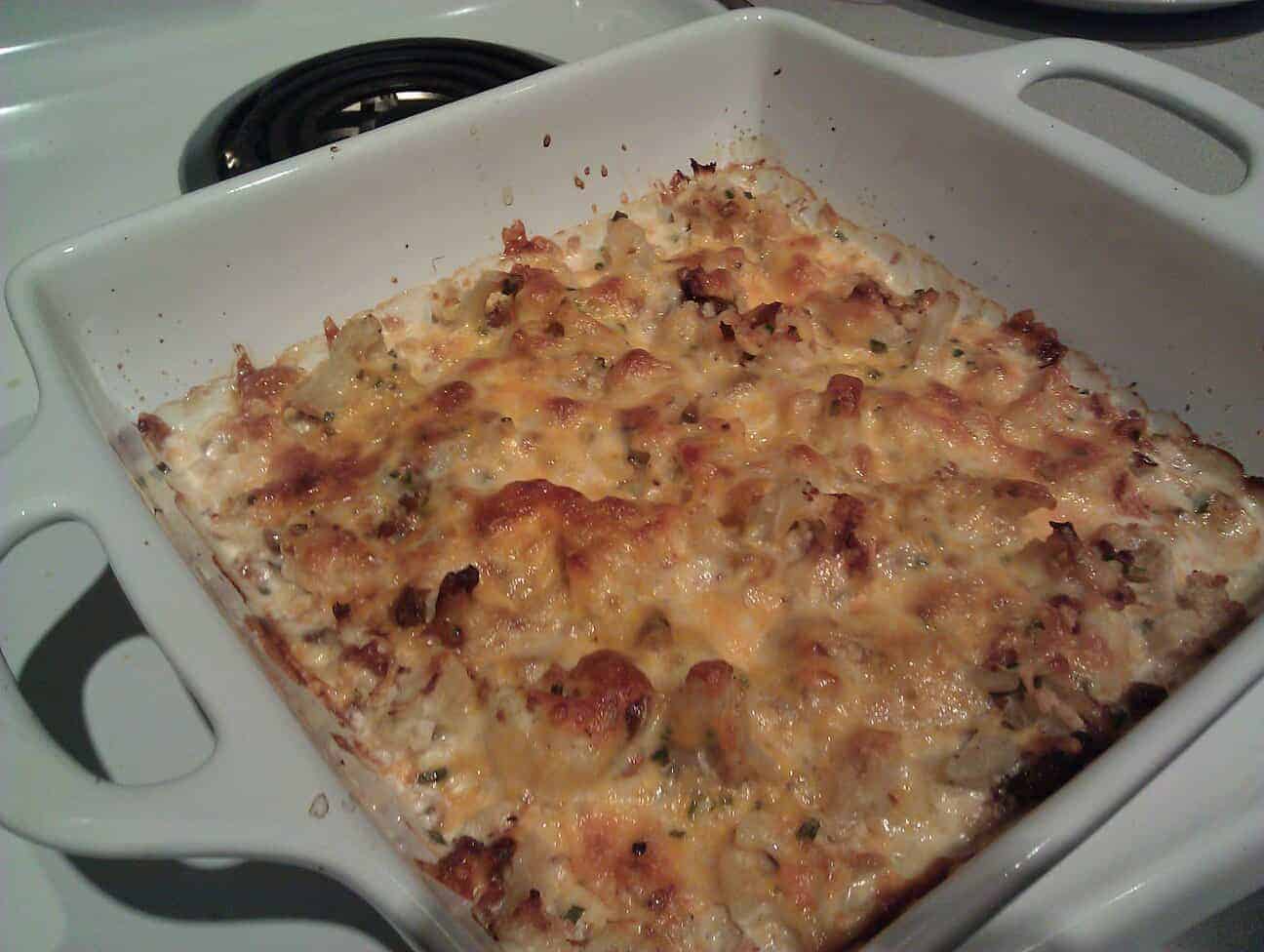 Cheesy Bacon Cauliflower in a white baking dish